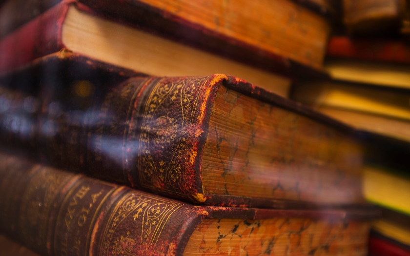 Close-up of antique books in leather covers, studio shot
